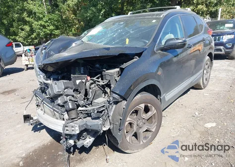 2018 Honda Cr-V Touring z USA, uszkodzony, nr VIN 7FARW2H94JE099983